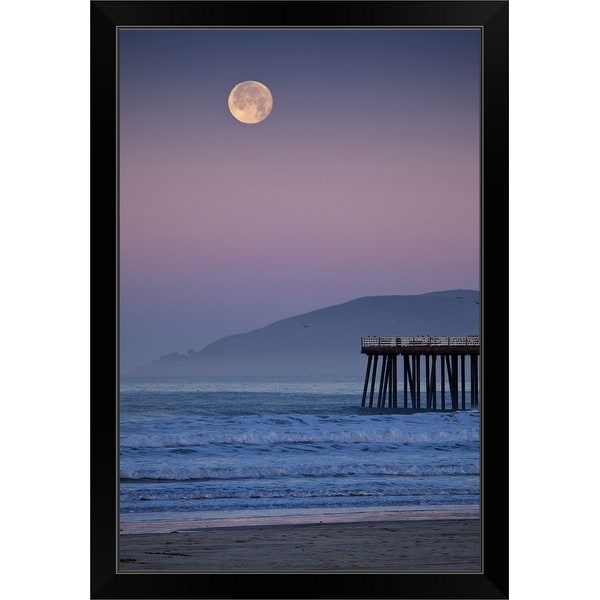 "Full moon sets over Pismo Beach at sunrise on winter morning." Black Framed Print
