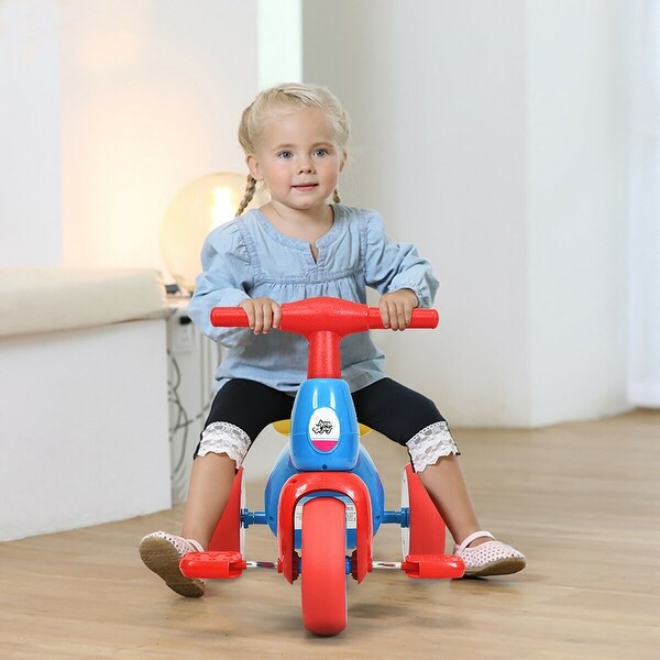 child riding tricycle