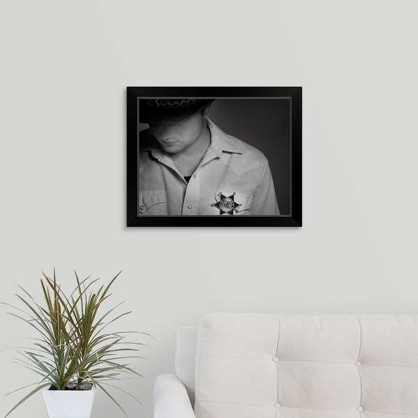 "Cowboy Looking Down Under Hat With Sheriff's Badge On Shirt" Black Framed Print