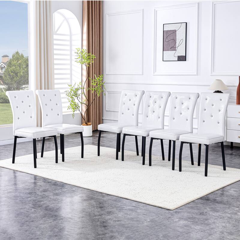 A set of 2 vintage crocodile leather cushioned dining chairs, featuring crystal clasp design and artificial leather design