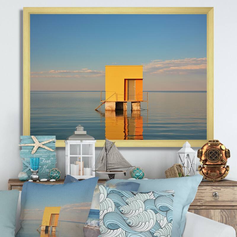 Designart "Coastal Minimalism Yellow Building In The Water I" Beach Framed Canvas Prints - 20 in. wide x 12 in. high - Gold