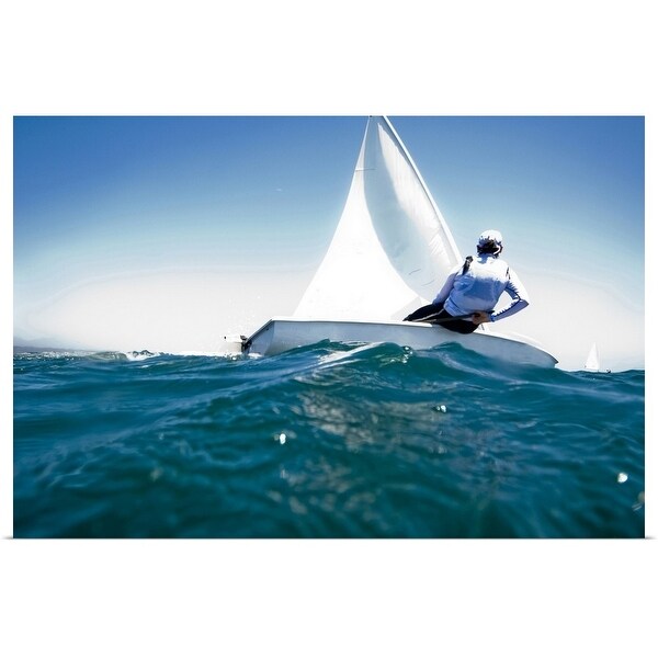 "A female athlete races a boat during a training session in Mexico." Poster Print
