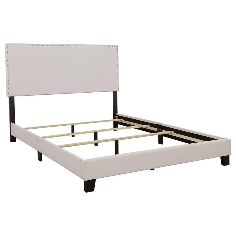 Elegant Ivory Queen Bed with Chrome Nailhead Trim and Black Wooden Legs