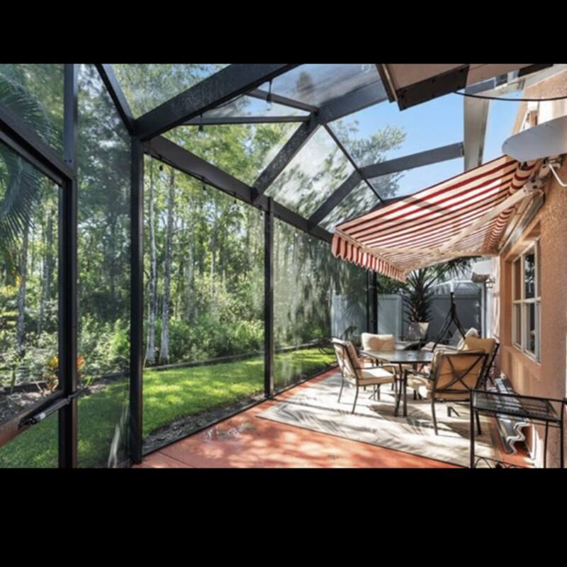 ALEKO Caribbean Motorized Patio Awning - White Frame - Red & White Striped - 20 x 10 Feet