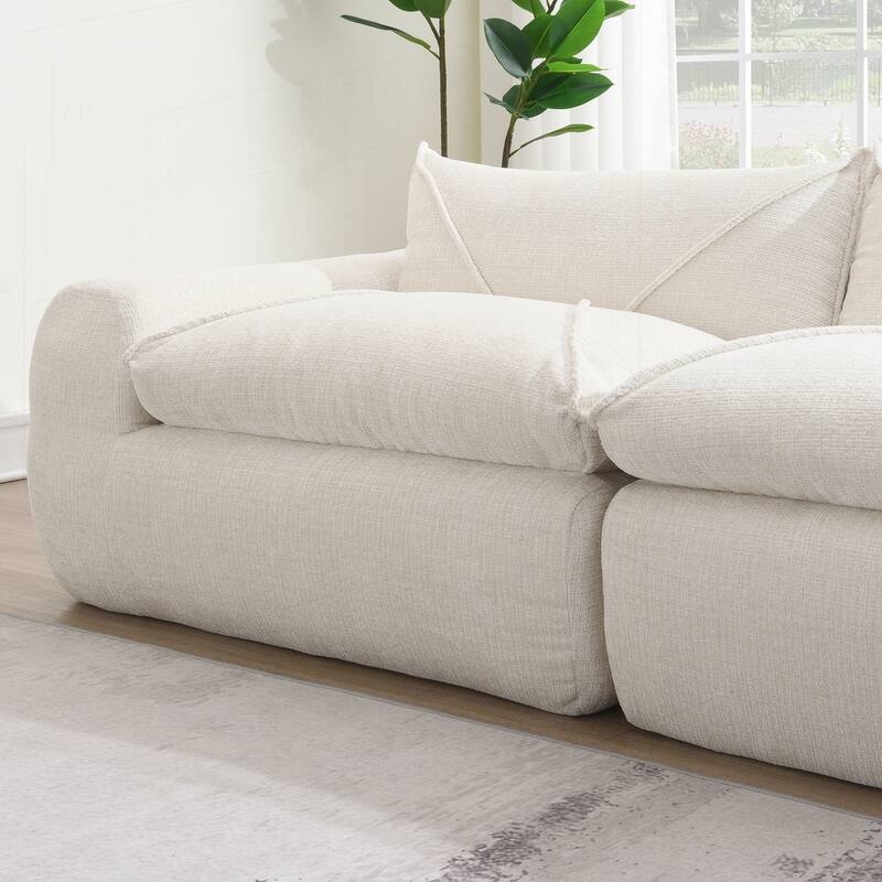 Versatile Compressed Sofa with Integrated Cushions and Movable Ottoman