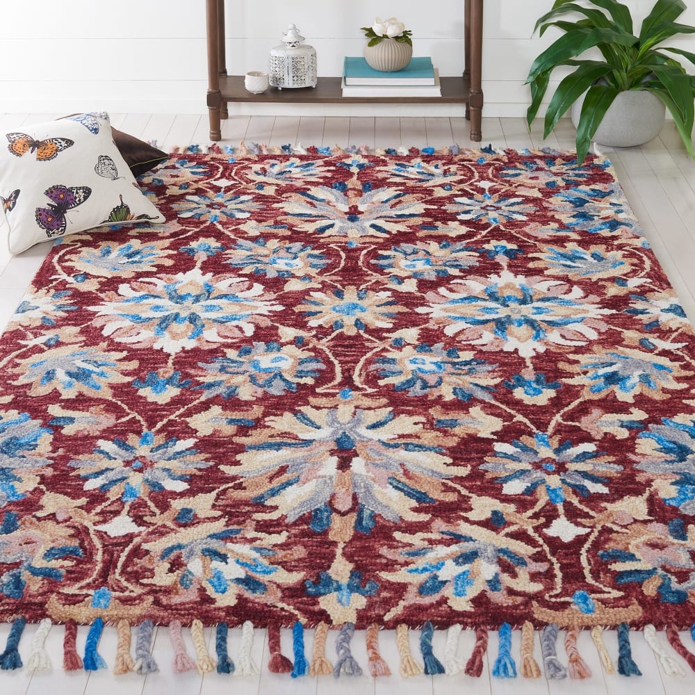 SAFAVIEH Handmade Aspen Orane Floral Braided Tassel Wool Rug