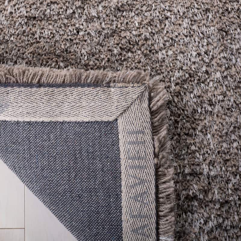 SAFAVIEH Handmade South Beach Leonella Shag Solid Polyester Rug