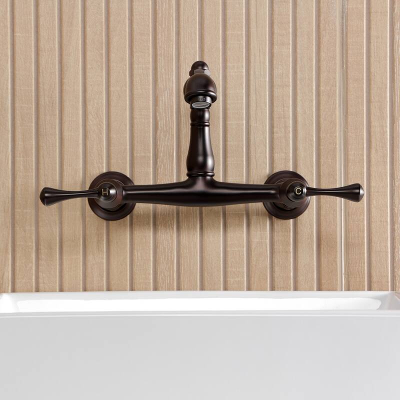 Kingston Brass English Country Two-Handle 2-Hole Wall Mount Bathroom Faucet