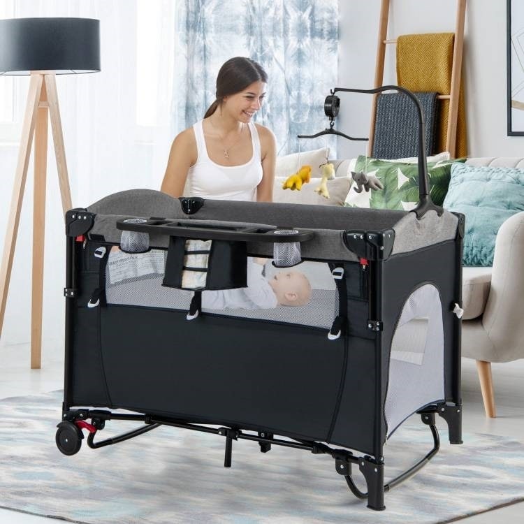 5-in-1 Infant Bed Cradle Changing Table with Side Storage and Music Rack Safety Strap - 43" x 29.5" x 32.5" (L x W x H)