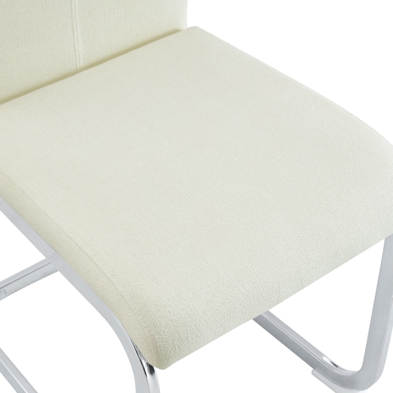 Luxury - style Dining Chairs.The combination of white grainy fabric-like fabric and silver metal legs is stylish.Set Of 2.