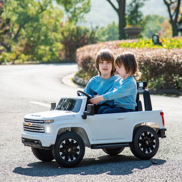 slide 2 of 17, Licensed Chevrolet Silverado HD 24V Ride-On Truck with Remote Control, 4WD, 2 Seats, FM/Bluetooth, and LED Lights White
