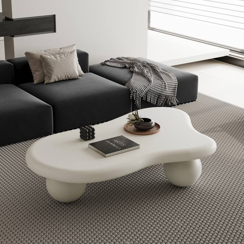 47 Inch Cloud Shaped Coffee Table with 3 Ball Legs for Living Room - Cream White