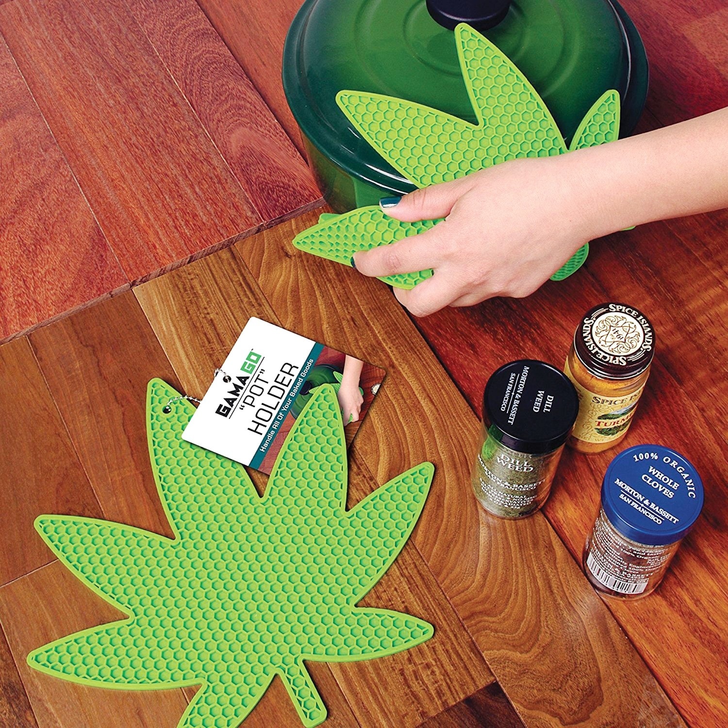 https://ak1.ostkcdn.com/images/products/is/images/direct/ddf13e5cf8f791f670772f0752c97f093cacd613/What-on-Earth-Leaf-Shaped-Pot-Holder---Green-Silicone-Safe-up-to-500-Degrees.jpg