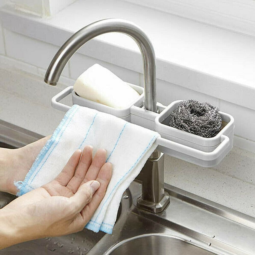 https://ak1.ostkcdn.com/images/products/is/images/direct/ddf8e637c17b0db1710a660ca124284315715600/Kitchen-Sink-Faucet-Sponge-Soap-Cloth-Drain-Rack-Storage-Organizer-Shelf-Holder.jpg