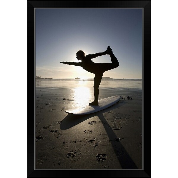 "silhouette of female surfer doing bow pulling yoga pose" Black Framed Print