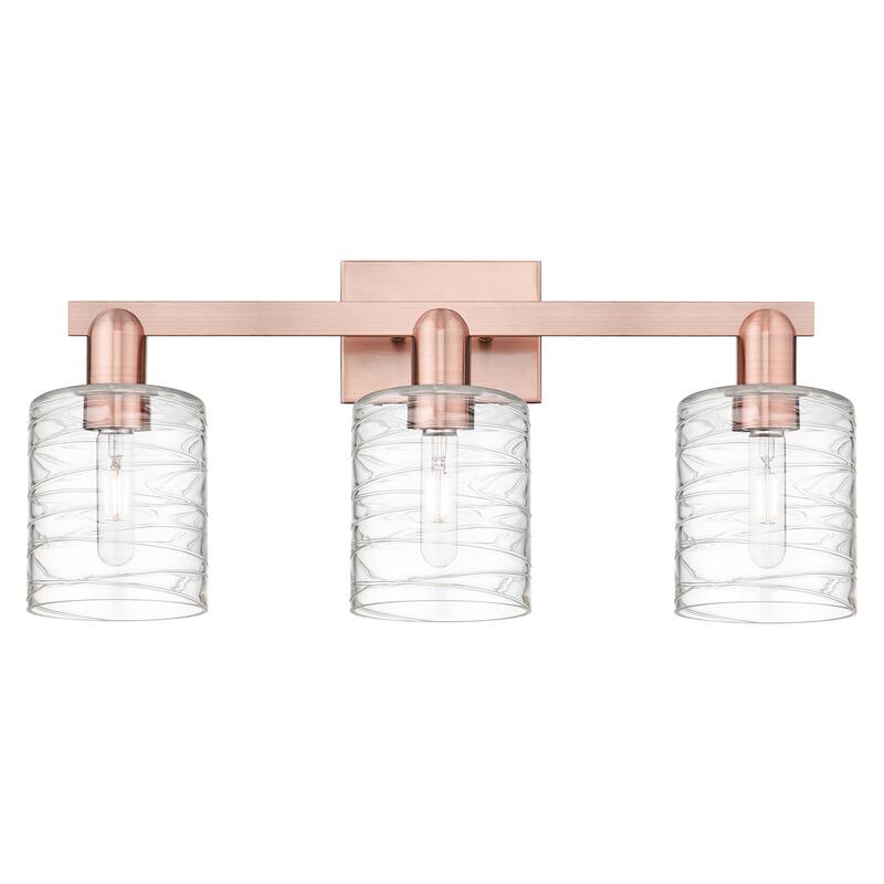 Innovations Lighting Endless Possibilities Arcadia - Cobbleskill - 3 Light 24" Bath Vanity Light - Deco Swirl/Antique Copper