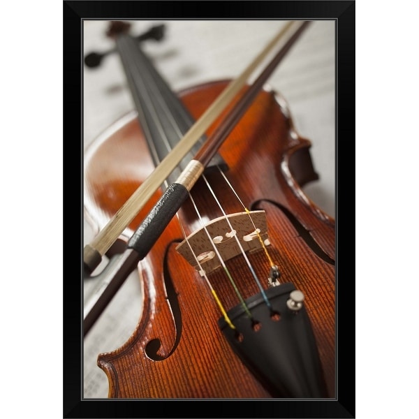 "Close-up of violin on sheet music" Black Framed Print