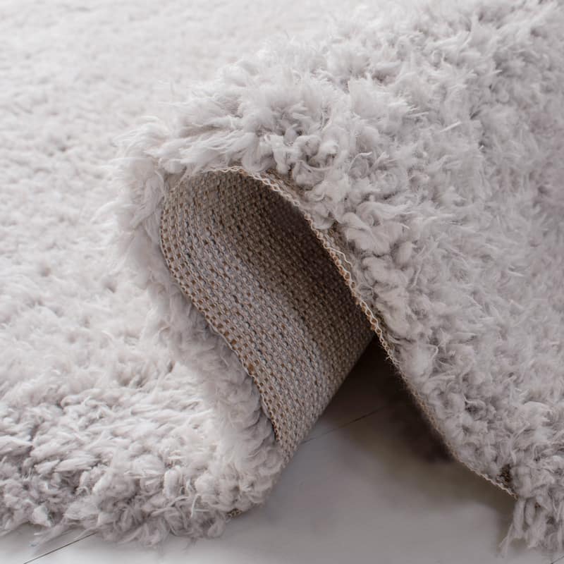 SAFAVIEH Flokati Vojsava Shag Solid Rug