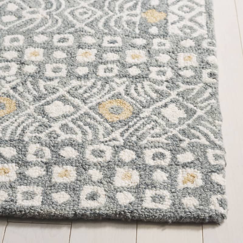 SAFAVIEH Handmade Micro-Loop Reglind Wool Rug
