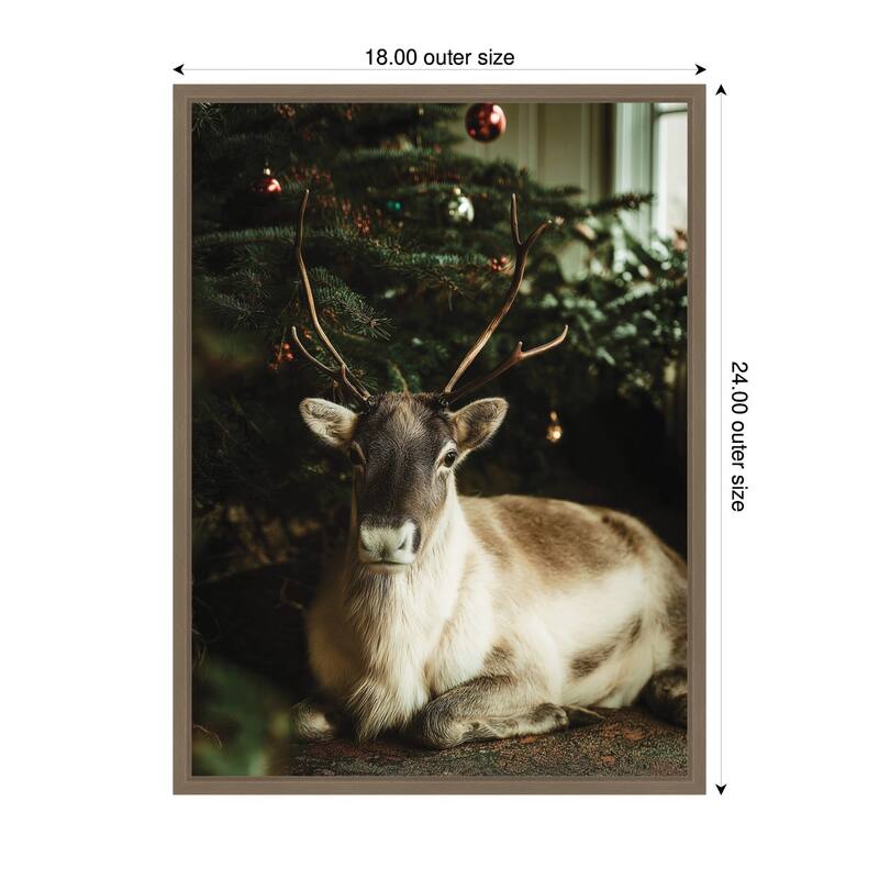 Kate and Laurel Sylvie Framed Canvas Reindeer Sitting Under a Christmas Tree by Michael Schauer