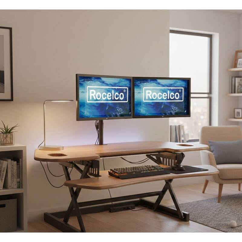 Rocelco 46 in. W Beige Height Adjustable Corner Standing Desk Converter Dual Monitor Riser with Gas Spring Assist System