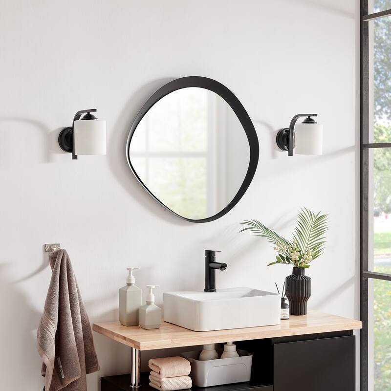 Danya B. Sonya 24-inch Contemporary Asymmetrical Round Wall Mirror with Raised Black Iron Frame