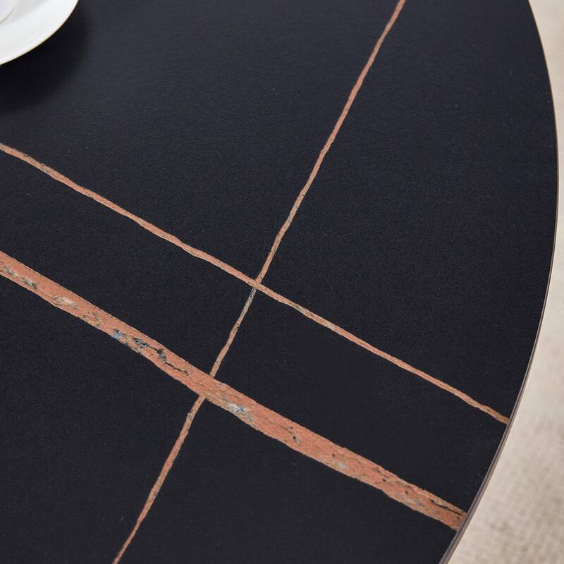 A 42-Inch Round Table with Stainless Steel Legs and a Marble Top, Perfect for 4 to 6 People.