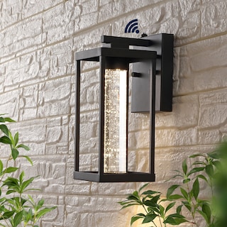 Justina 4.75" 1-Light Industrial Iron/Seeded Glass with Dusk-to-Dawn Sensor Integrated LED Outdoor Sconce, Black by JONATHAN Y
