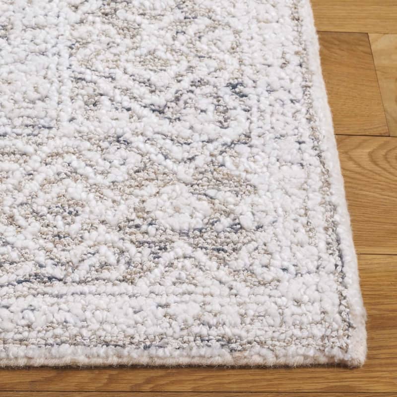 SAFAVIEH Handmade Ebony Kinue Wool Rug