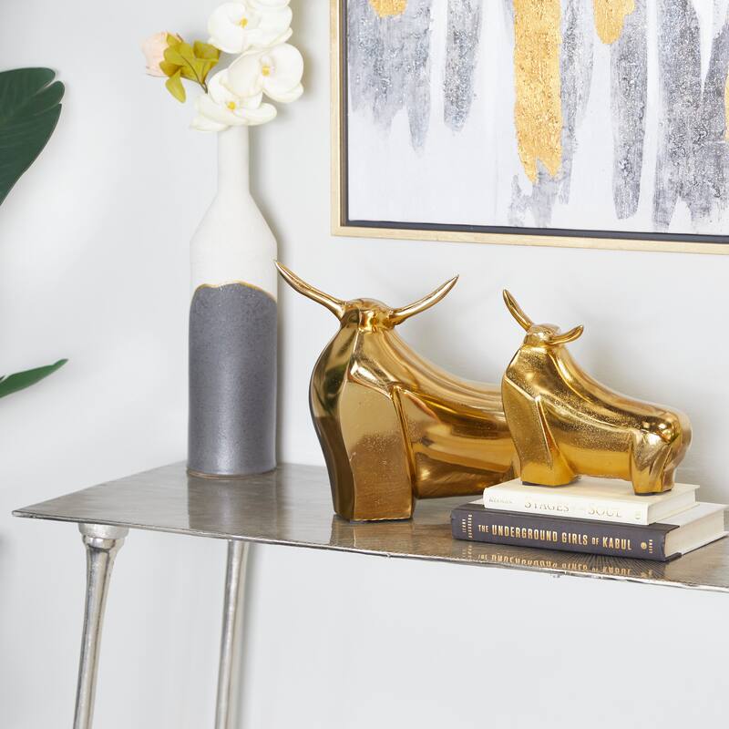CosmoLiving by Cosmopolitan Aluminum Metal Bull Sculpture (Set of 2) - Silver or Gold