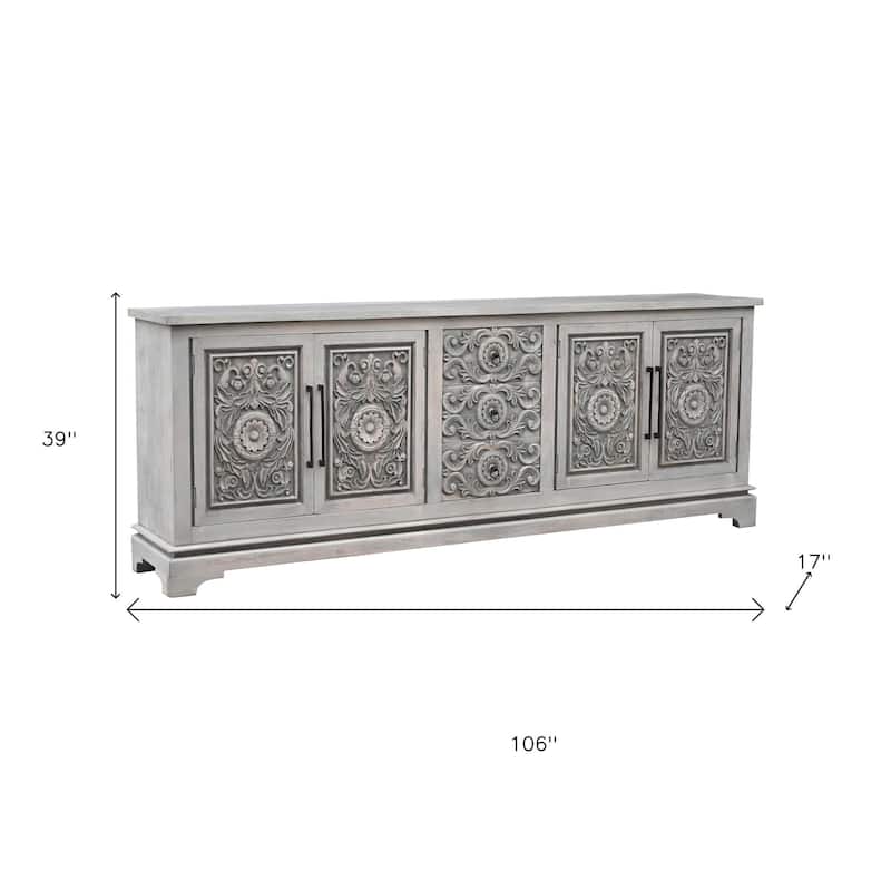 HomeRoots 106" Gray Distressed Solid Wood Carved Floral Three Drawer Sideboard with Four Doors