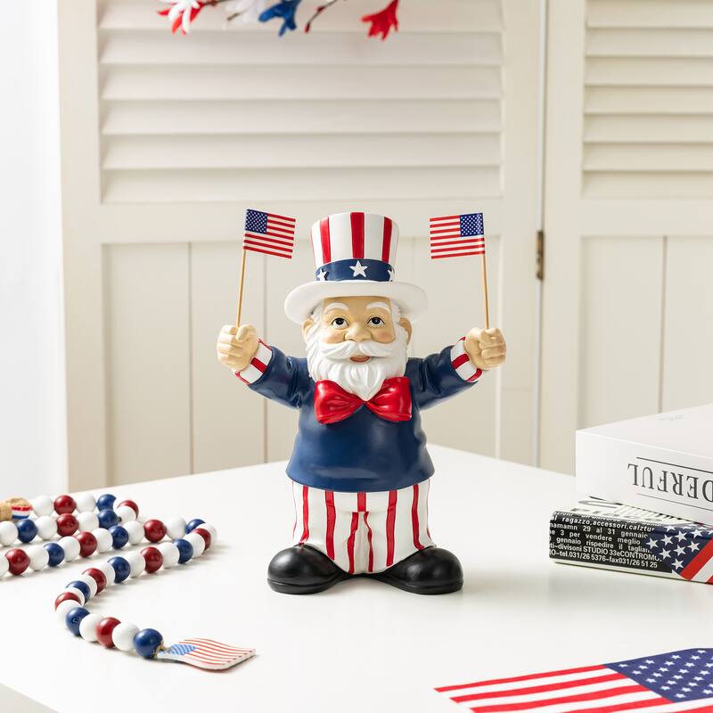 Glitzhome 9"H Patriotic/ Americana Polyresin Santa Holding Flags Table Decor