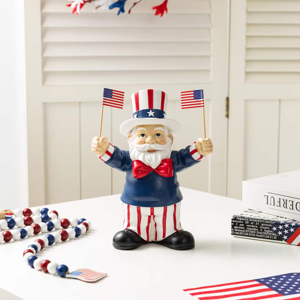 Glitzhome 9"H Patriotic/ Americana Polyresin Santa Holding Flags Table Decor