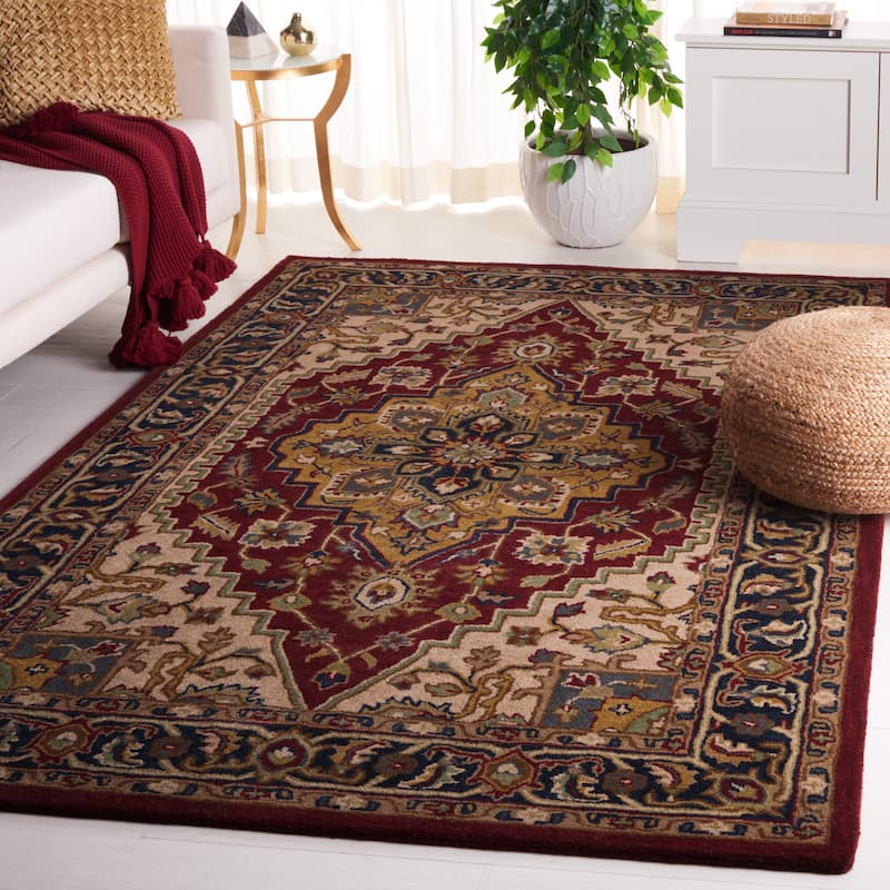SAFAVIEH Handmade Heritage Tieneke Traditional Wool Rug - 5' x 8' - Red/Ivory