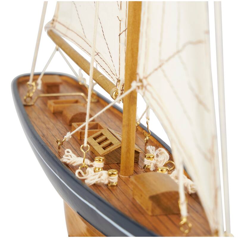 Brown Wood Sail Boat Decorative Sculpture with Beige and Navy Accents and Lifelike Rigging