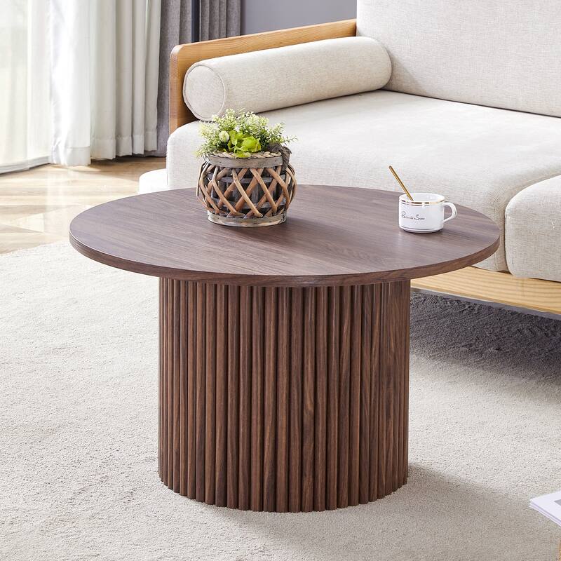 A modern circular coffee table with a diameter of 27.5 inches. MDF material,cylindrical table leg design - Walnut