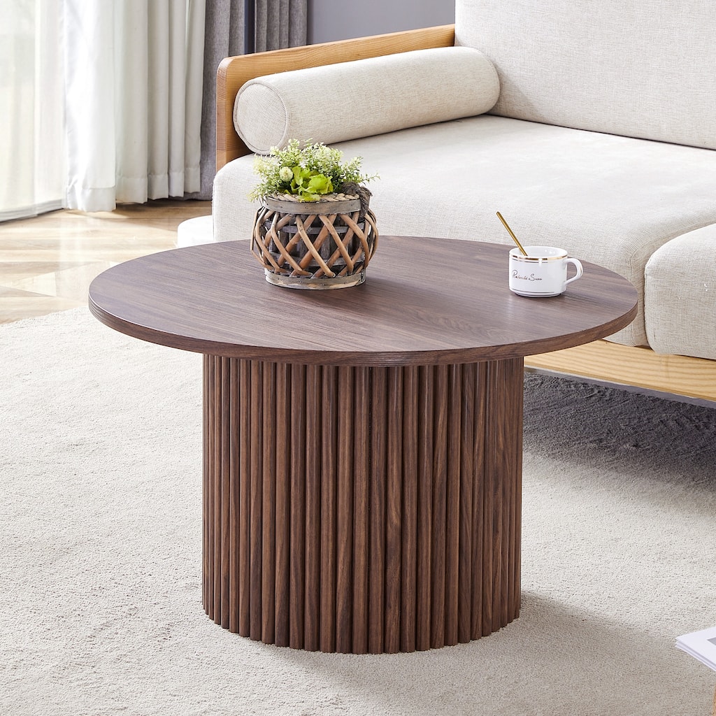 A modern circular coffee table with a diameter of 27.5 inches. MDF material,cylindrical table leg design