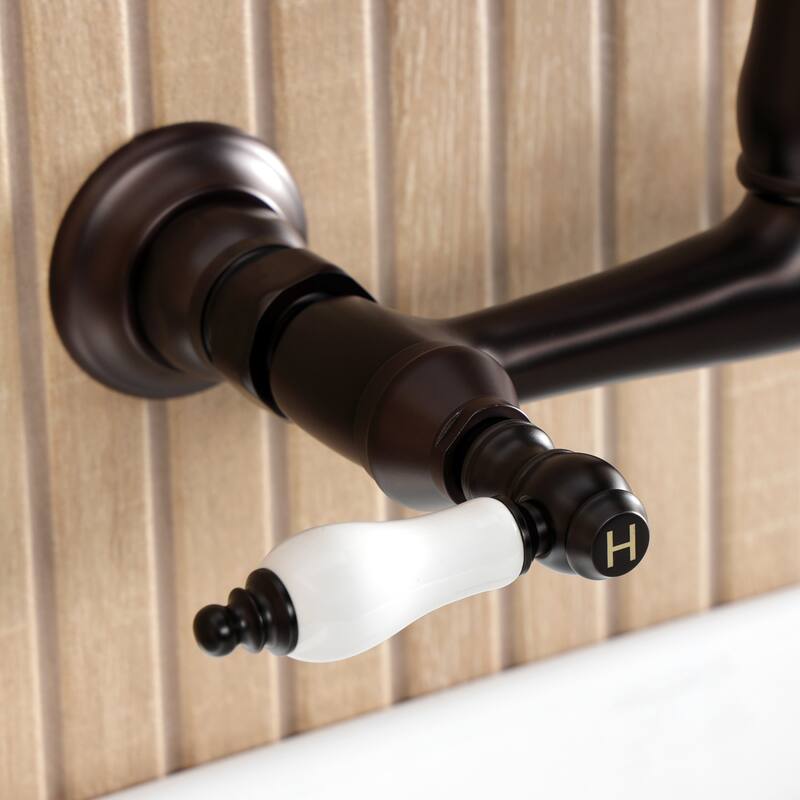 Kingston Brass English Country Two-Handle 2-Hole Wall Mount Bathroom Faucet