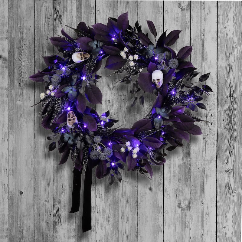 National Tree Company 26" Artificial Floral Mini Skull Wreath, 30 Purple LED Lights, Battery Operated - 26 in