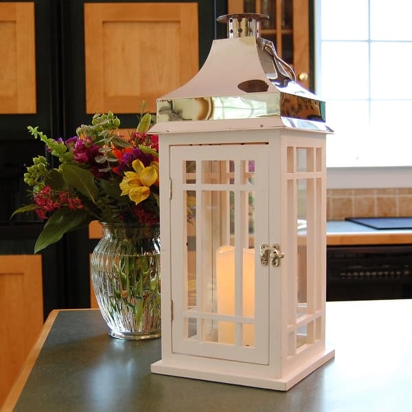 https://ak1.ostkcdn.com/images/products/is/images/direct/e5e3fa55e4fbb7d930c68c36bb4624f7aecf3be7/18%22-White-Wooden-Lantern-with-Chrome-Roof-and-Flame-Less-LED-Candle.jpg?impolicy=medium