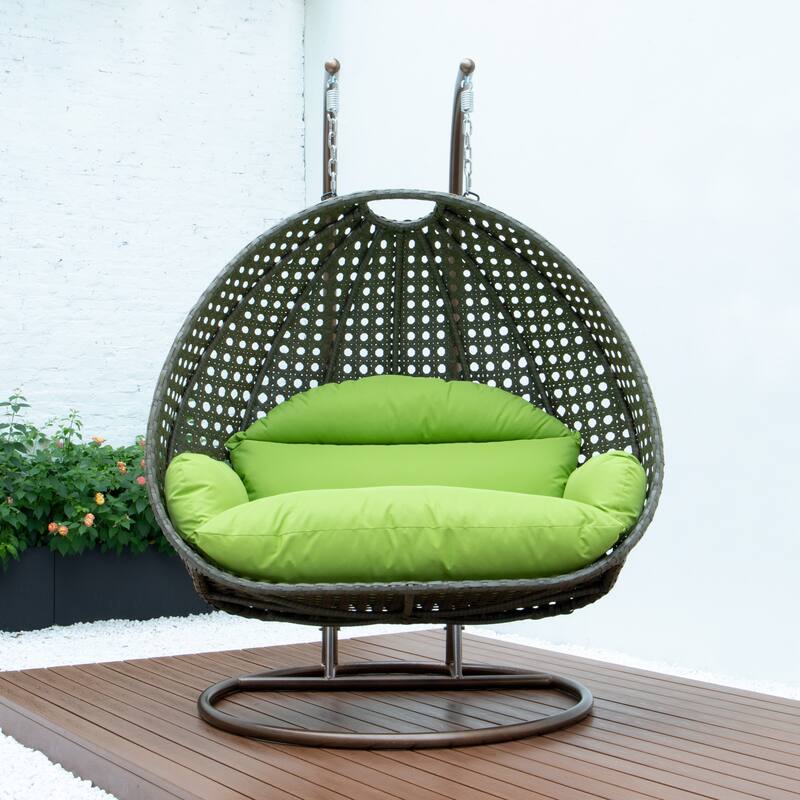 LeisureMod 2-Person Hanging Egg Swing Chair with Metal Stand - Handcrafted Beige Wicker, Patio Hammock Lounger with Cushions