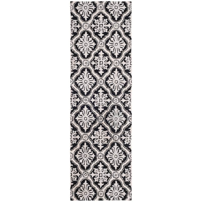 SAFAVIEH Handmade Easy Care Vaxhide Oriental Rug