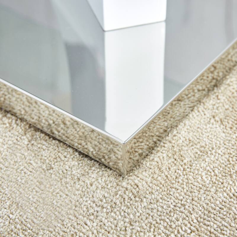 A rectangular modern and fashionable coffee table with tempered glass tabletop and white MDF legs. Suitable for living r