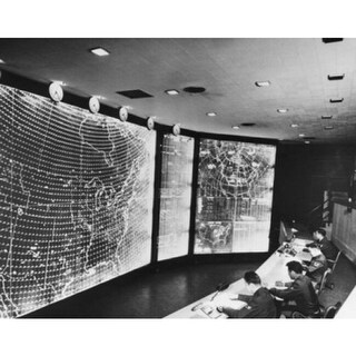 High Angle View Of Four Men Sitting In A Control Room North American ...