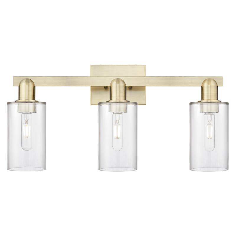 Innovations Lighting Endless Possibilities Arcadia - Clymer - 3 Light 23" Bath Vanity Light - Antique Brass/Clear