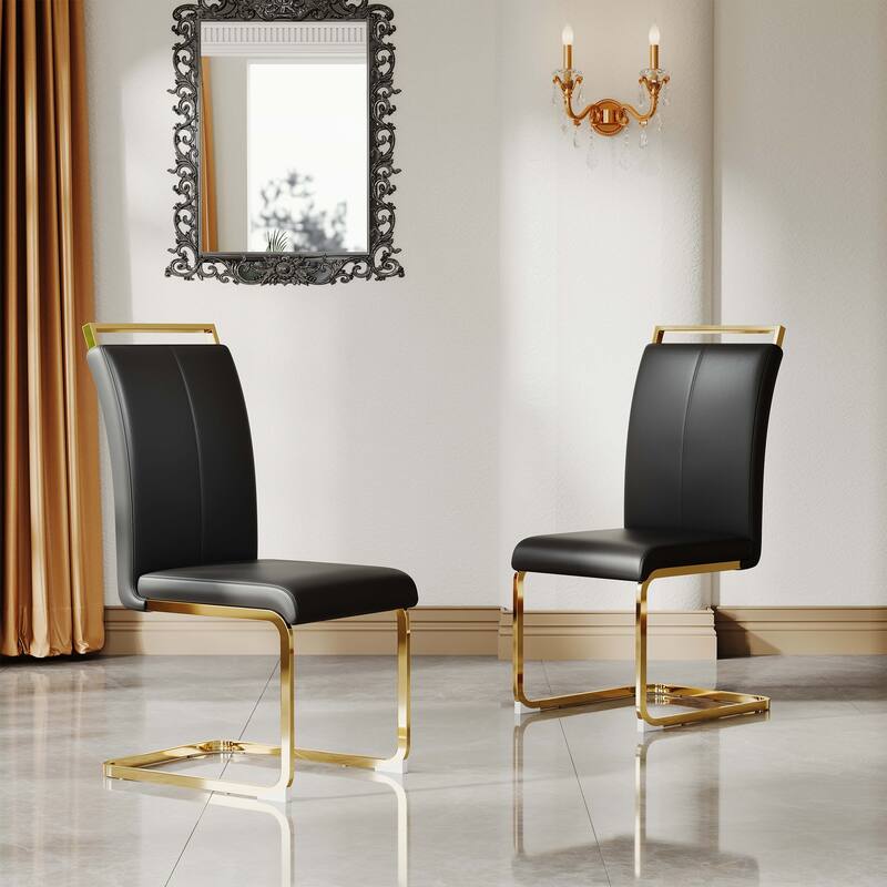 A set of 4 artificial leather dining chairs