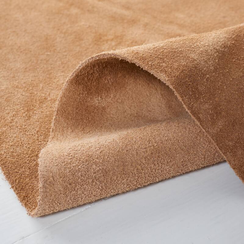 SAFAVIEH Handmade Cow Hide Radomila Cabin & Lodge Rug