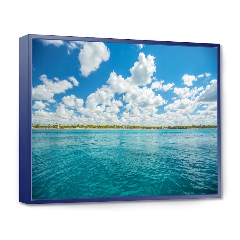 Designart "White Fluffy Clouds Over Sea" Oversized Beach Framed Canvas Artwork Print - 20 in. wide x 12 in. high - Blue
