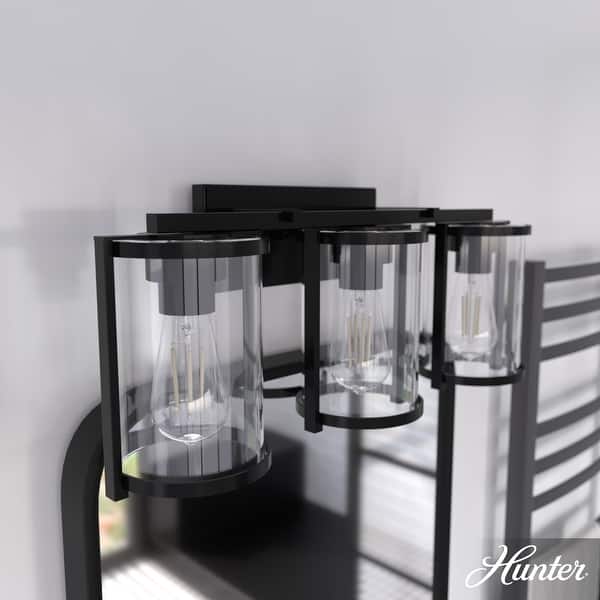 slide 2 of 10, Hunter Astwood Bathroom Vanity Light, Clear Cylinder Glass, Damp Rated, Caged - Contemporary, Transitional, Art-Deco 3-Light 24" - Matte Black