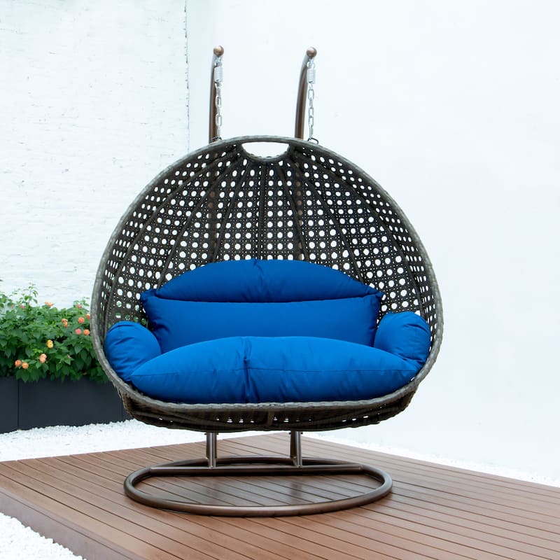 LeisureMod 2-Person Hanging Egg Swing Chair with Metal Stand - Handcrafted Beige Wicker, Patio Hammock Lounger with Cushions